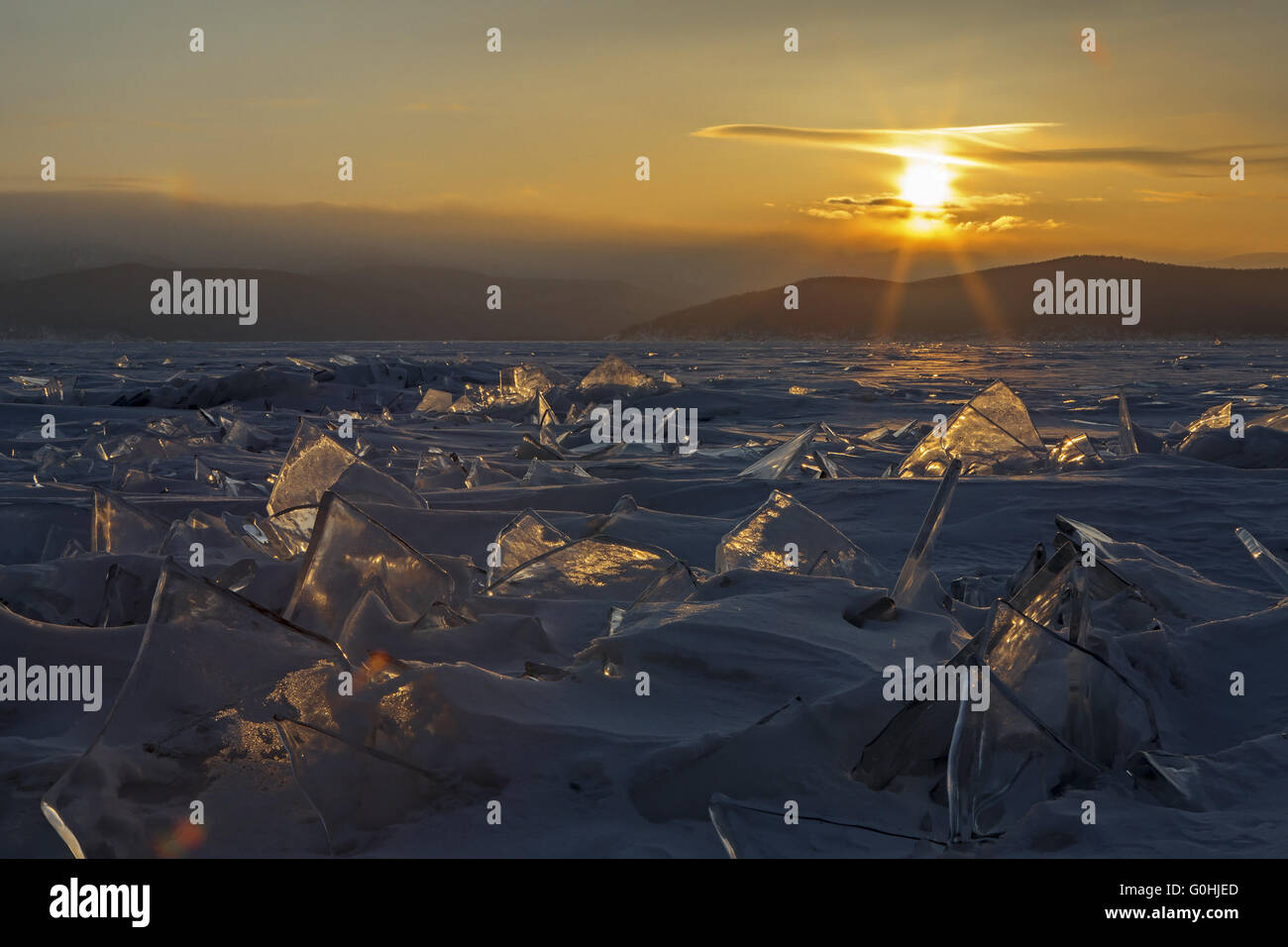 Sun Rising Ice Transparent pieces of ice and the rising sun Stock Photo - Alamy