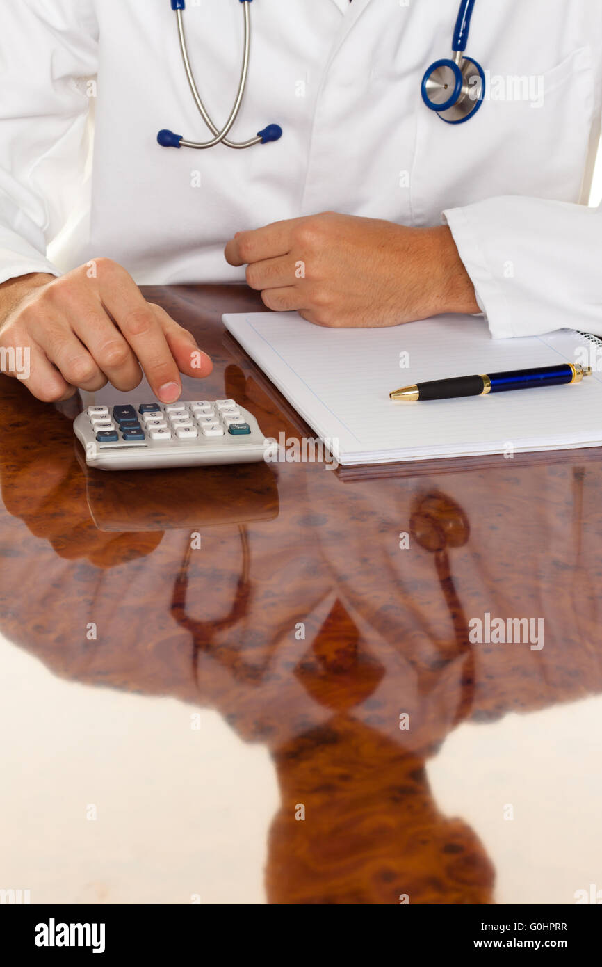 Doctor with a calculator. Costing medical practice Stock Photo