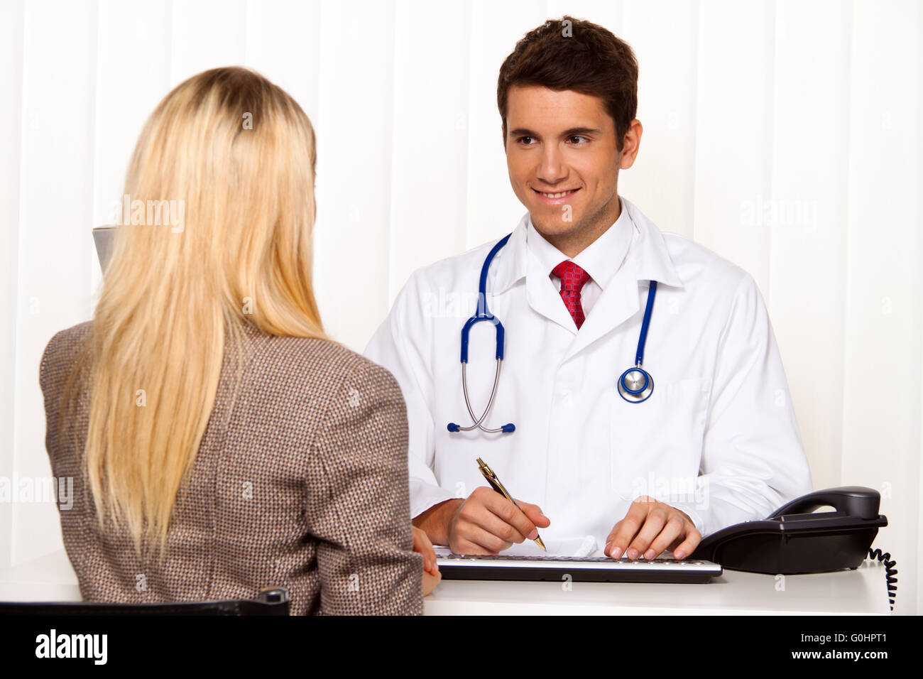 Doctors call. Patient and doctor in discussion in medical practice Stock Photo