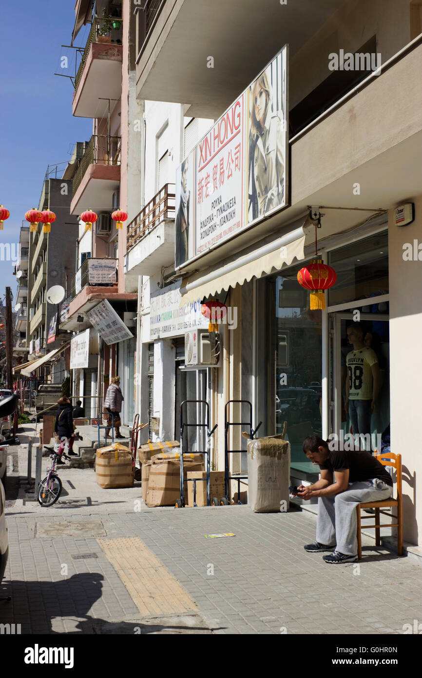 Chinese business shop displays and cartons full of merchantise laid on  Aisopou (or Essopou) street. China town, Thessaloniki Stock Photo - Alamy