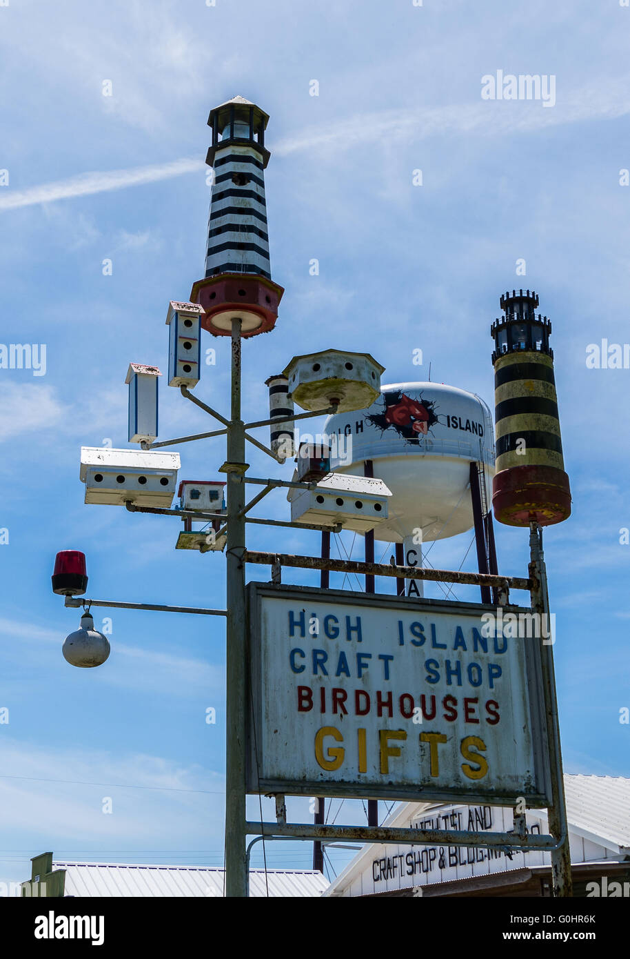 Bird houses of all size and shape in front of iconic water tower at High Island, Texas. USA. Stock Photo