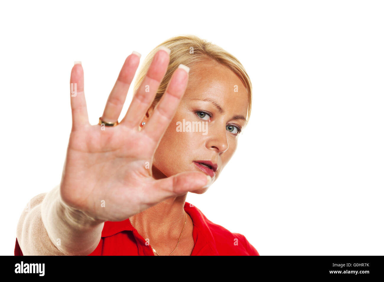 Woman holding hands in front of her face. Stock Photo