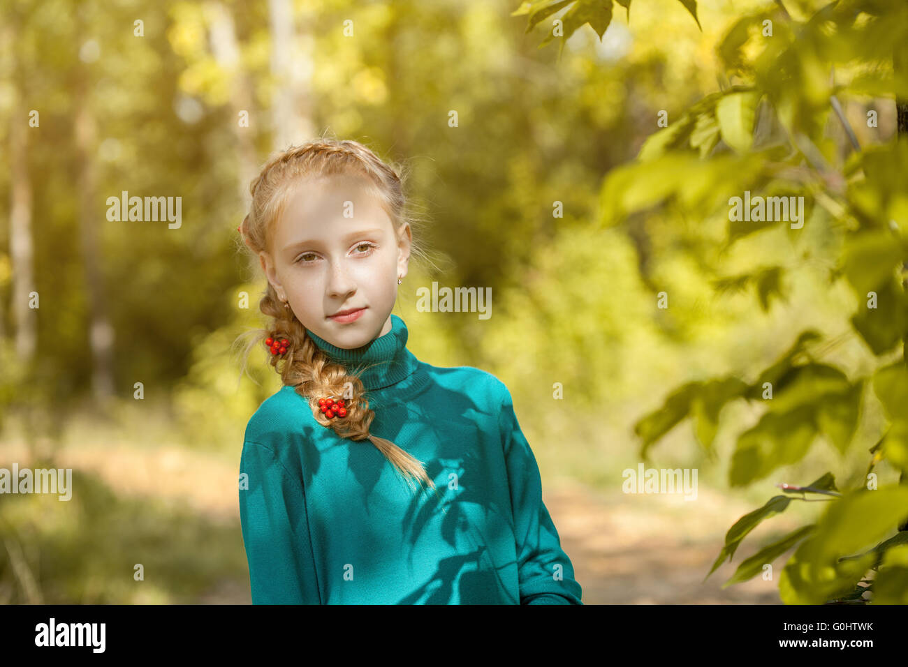 Portrait of charming freckled girl with pigtail Stock Photo