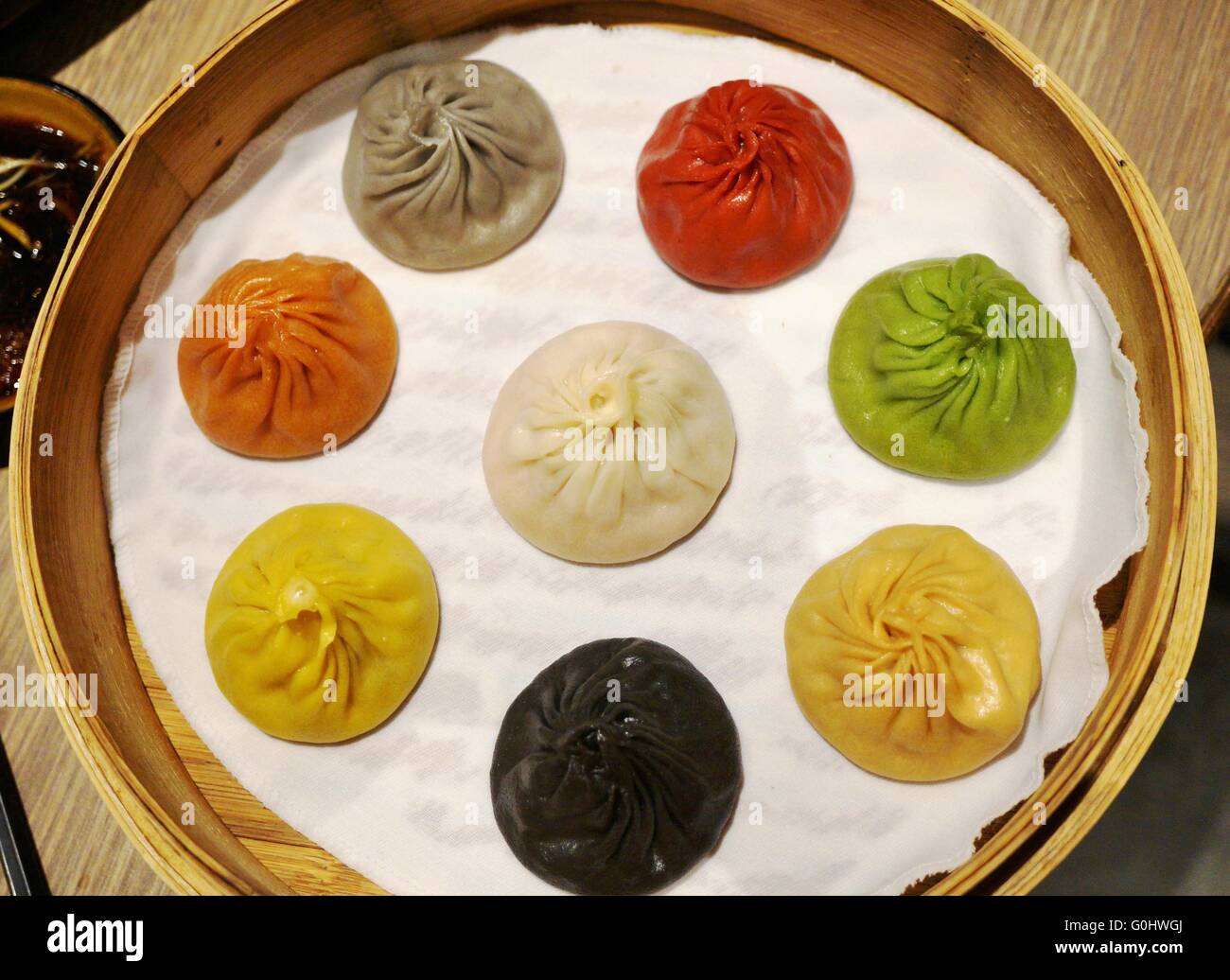 Colorful xiao long bao soup dumplings in a steam basket Stock Photo Alamy