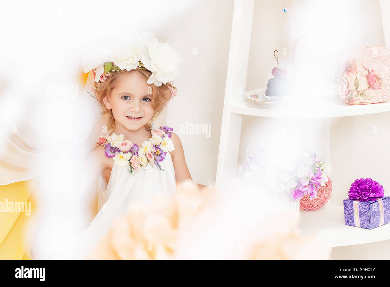 Image of adorable girl posing in floral wreath Stock Photo - Alamy