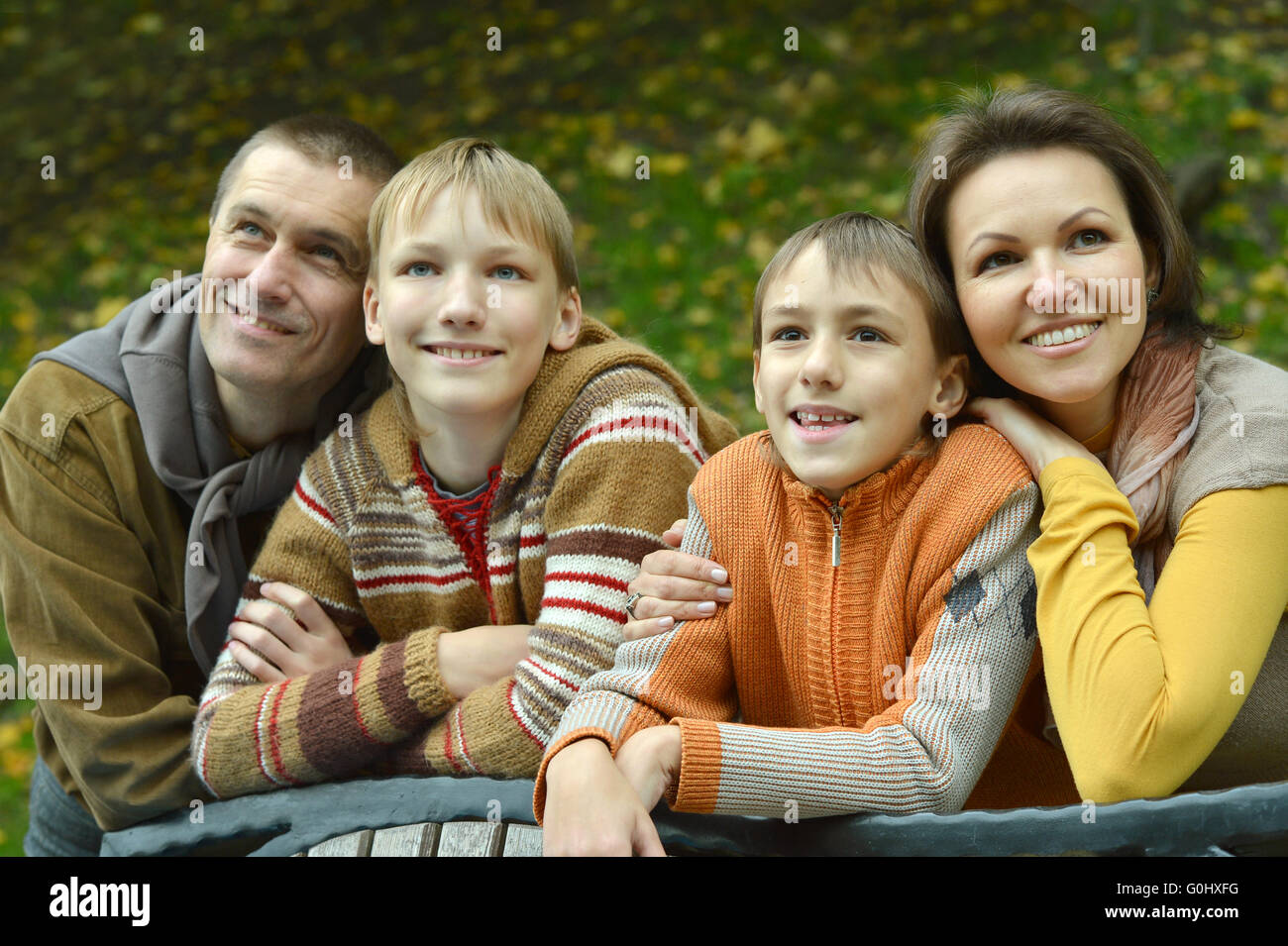 Happy family of four Stock Photo - Alamy