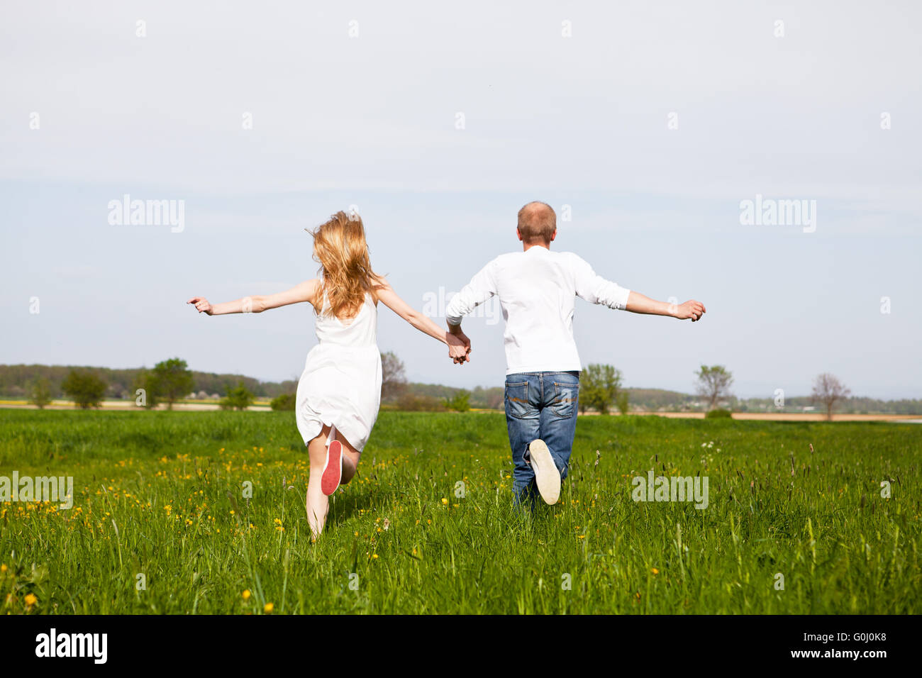 young happy couple have fun in summer Stock Photo - Alamy