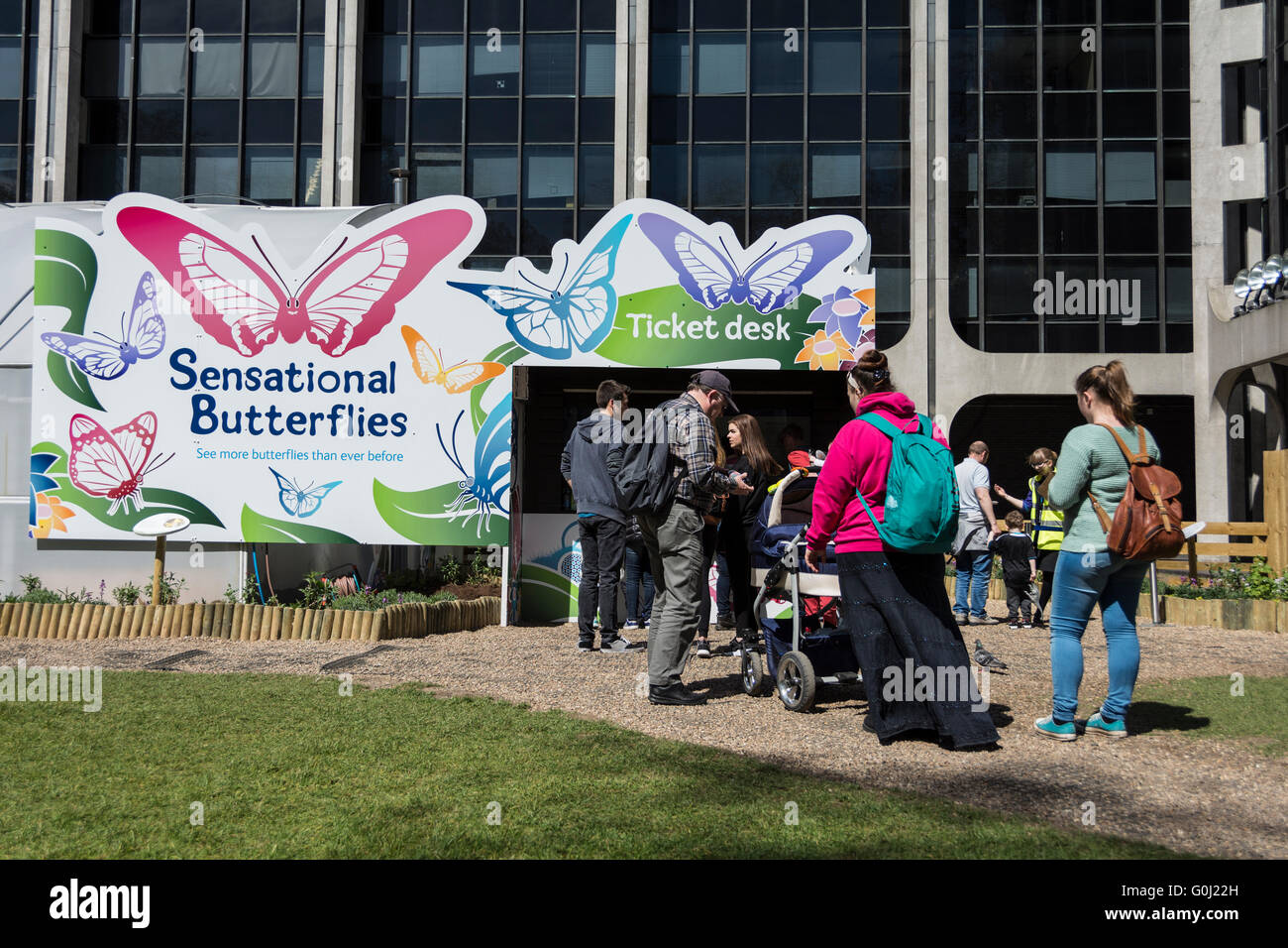 Visitors queue in front of the National History Museum's Sensational Butterflies exhibition in London's 'Museum Quarter' Stock Photo