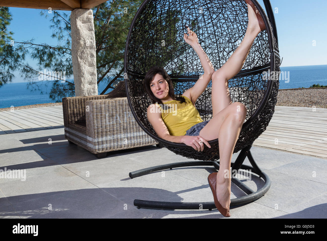 Portrait of beautiful young woman relaxing Stock Photo - Alamy