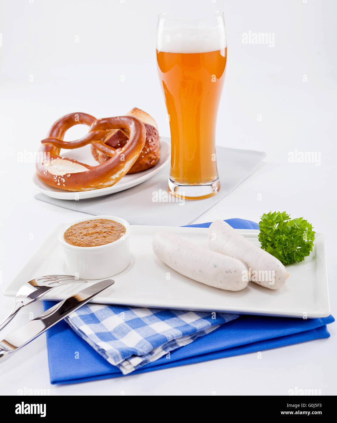 weisswurst white sausages and sweet mustard with pretzel Stock Photo