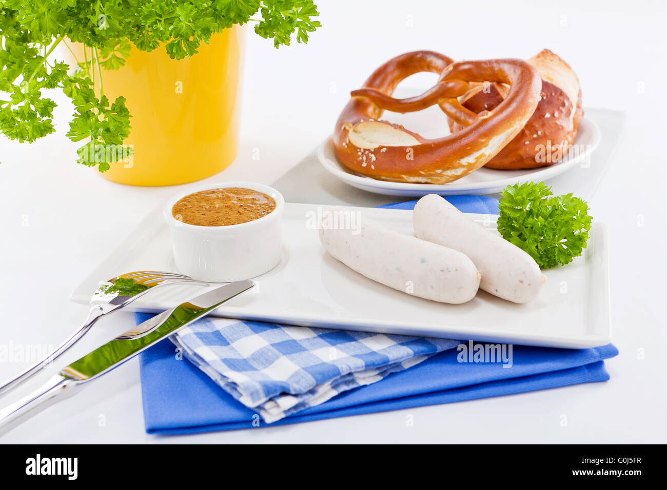 weisswurst white sausages and sweet mustard with pretzel Stock Photo