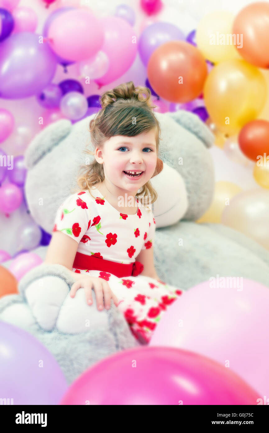 Image of merry little girl posing in playroom Stock Photo - Alamy