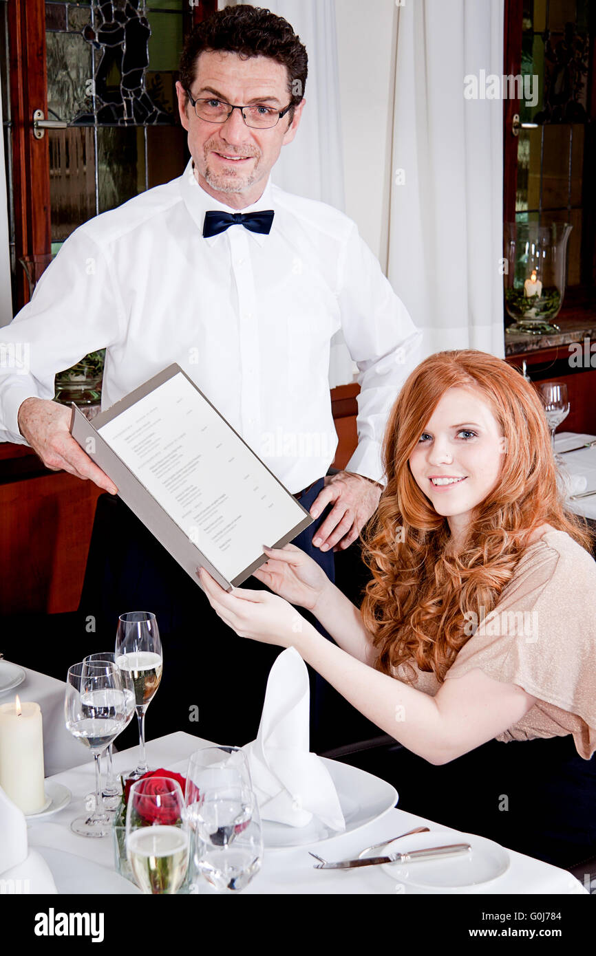 Restaurant staff pointing menu hi-res stock photography and images - Alamy