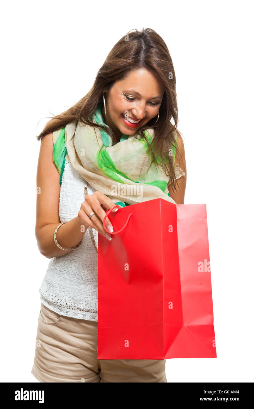 Fashionable Woman Looking Inside a Shopping Bag Stock Photo