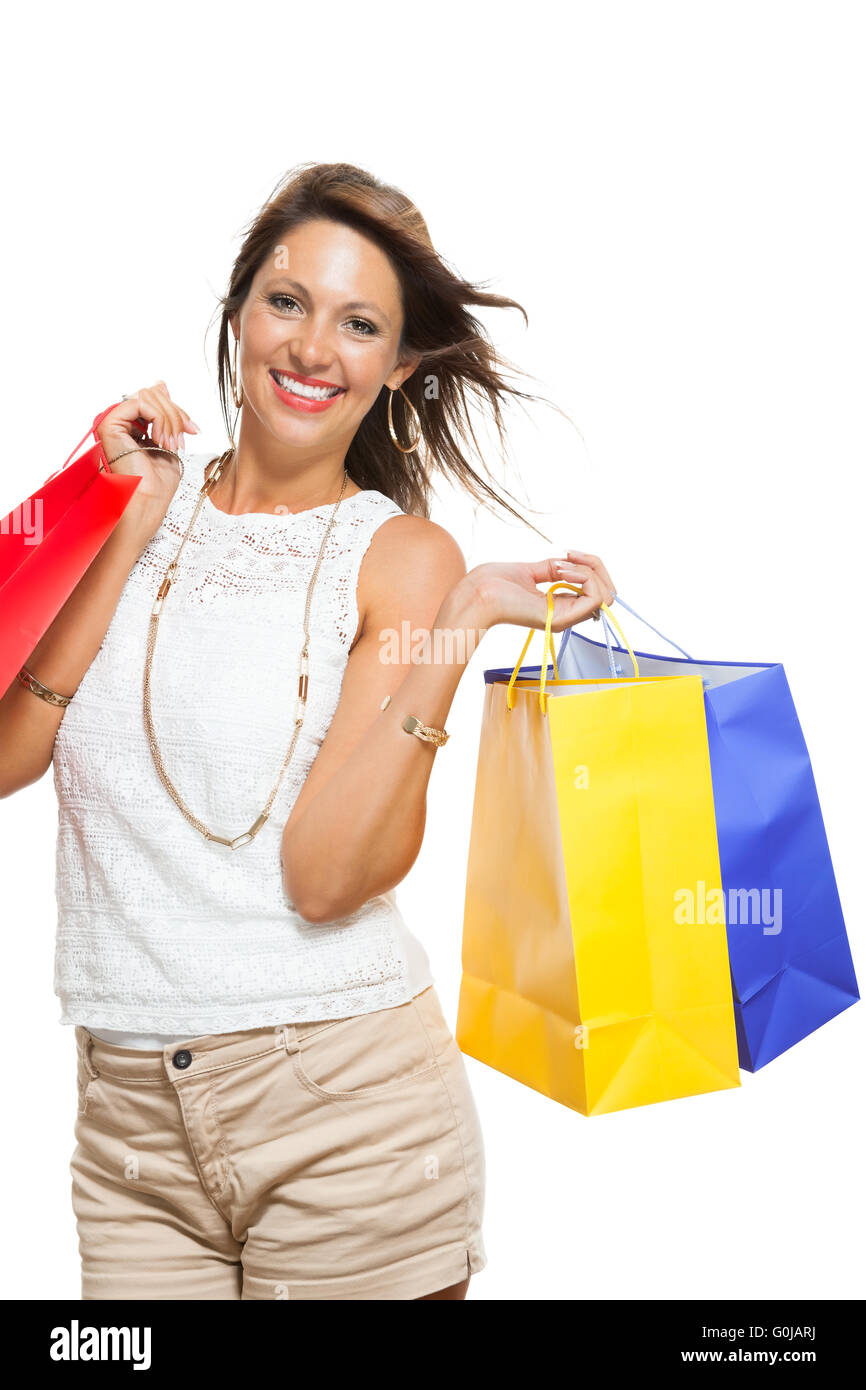 Happy Woman Raising Colored Shopping Bag Stock Photo