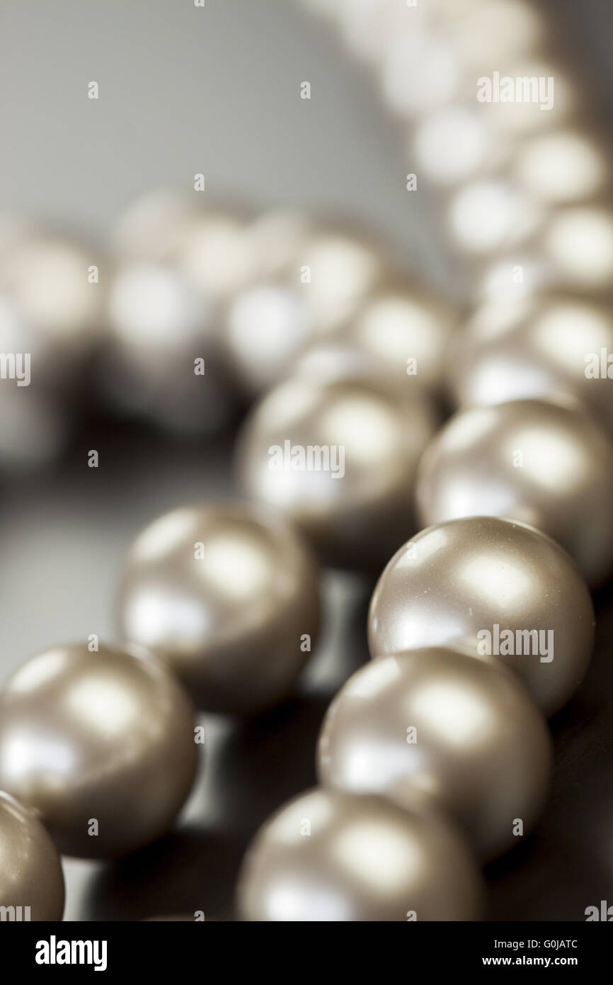 String of shiny grey beads Stock Photo