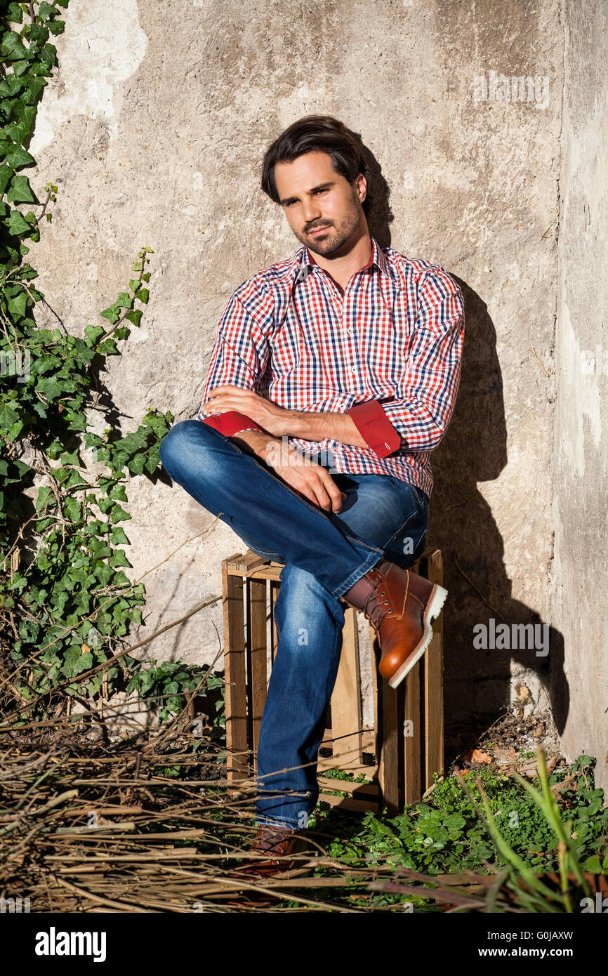Male model sitting legs crossed hires stock photography and images Alamy