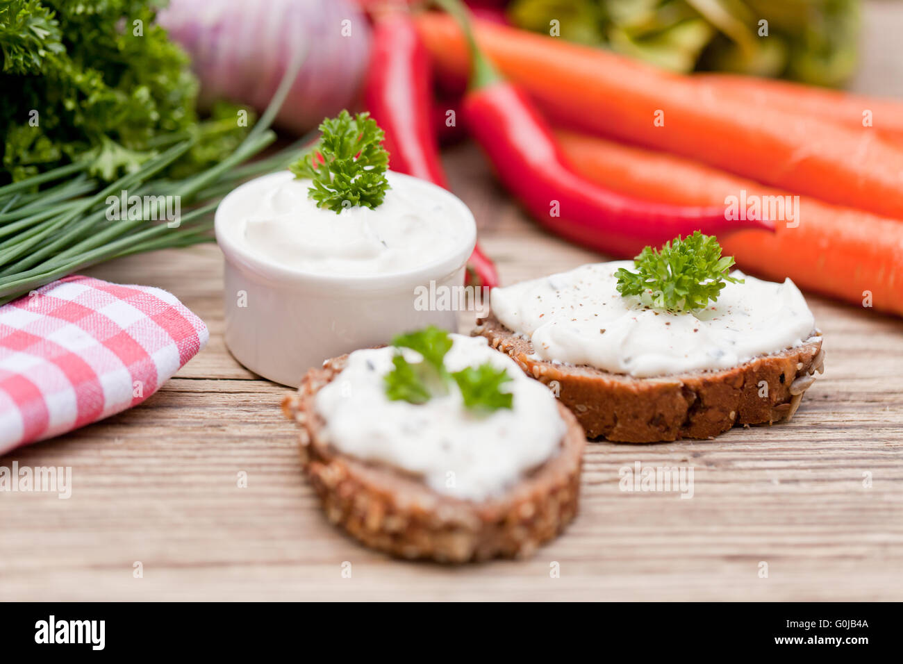 fresh tasty homemade cream cheese and herbs with bread Stock Photo