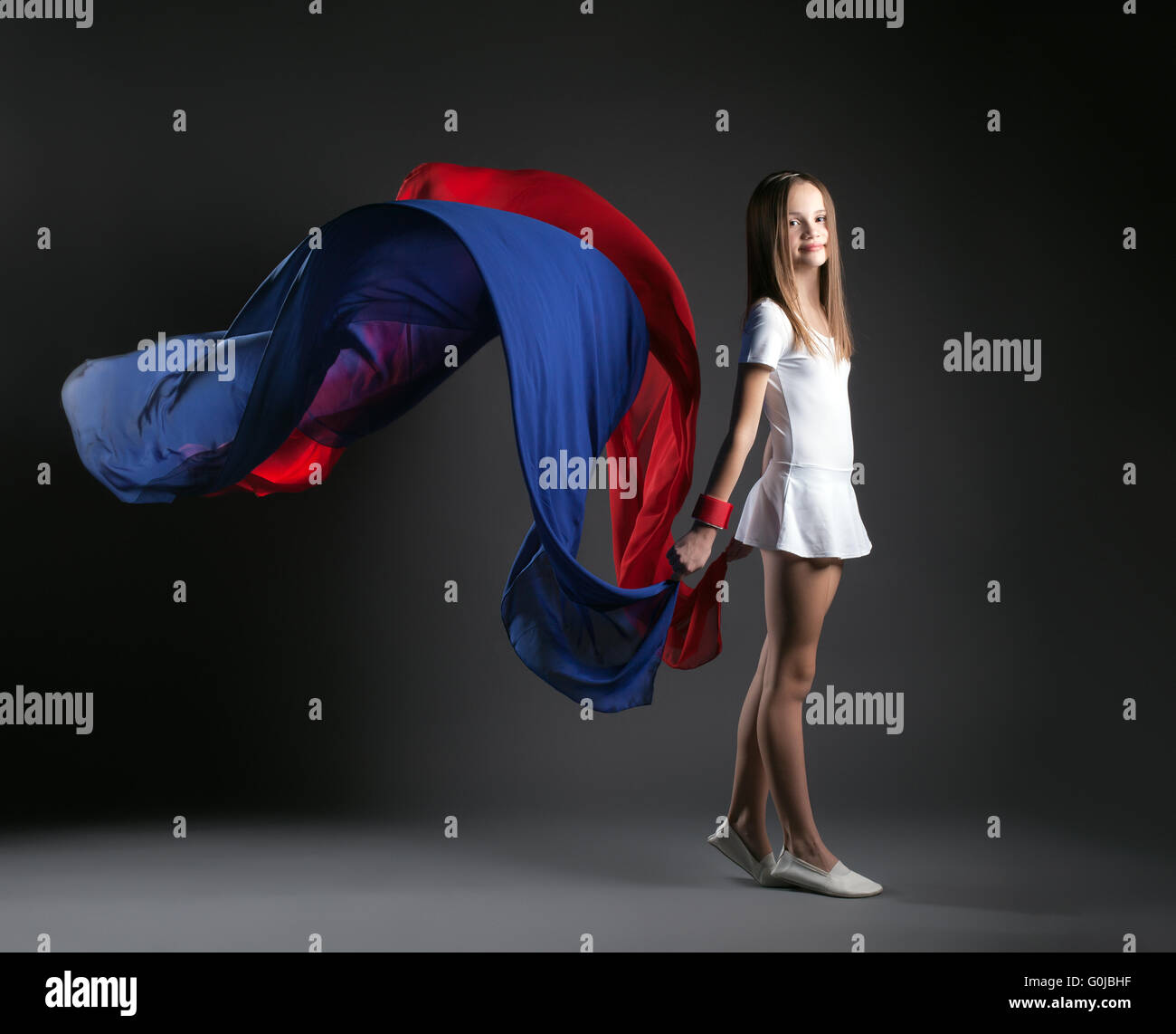 Image of smiling girl posing with colorful cloth Stock Photo - Alamy