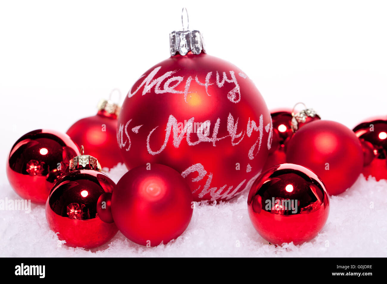 Silver christmas baubles in the snow hi-res stock photography and ...