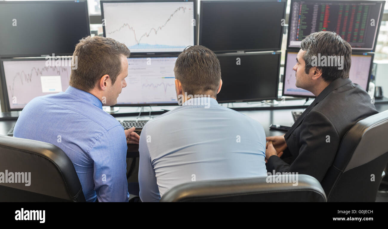 Trader looking data on screens hi-res stock photography and images - Alamy