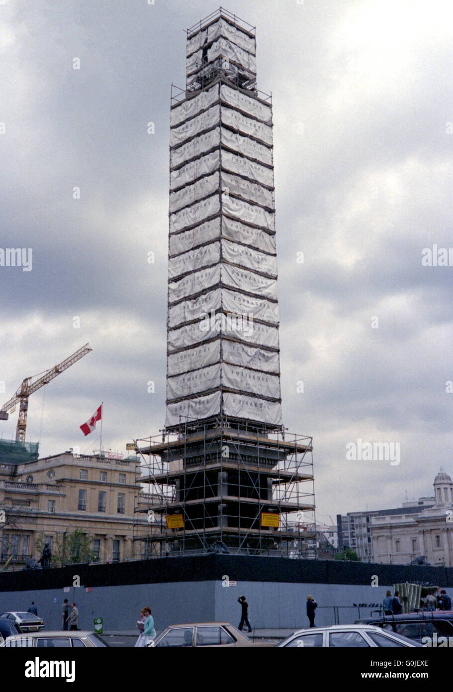AJAXNETPHOTO. 1987. LONDON, ENGLAND. - NELSON'S COLUMN - SURROUNDED BY SCAFFOLDING AS IT UNDERGOES A CLEAN. PHOTO:JONATHAN EASTLAND/AJAX  REF:1987RSE34A002 Stock Photo