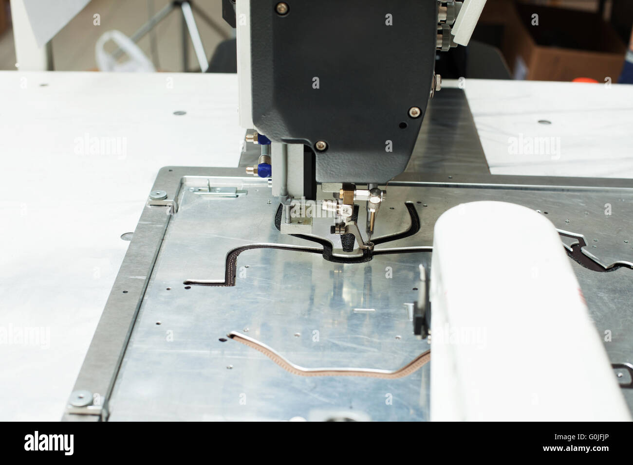 Closeup of sewing machine stitching on patterns Stock Photo Alamy