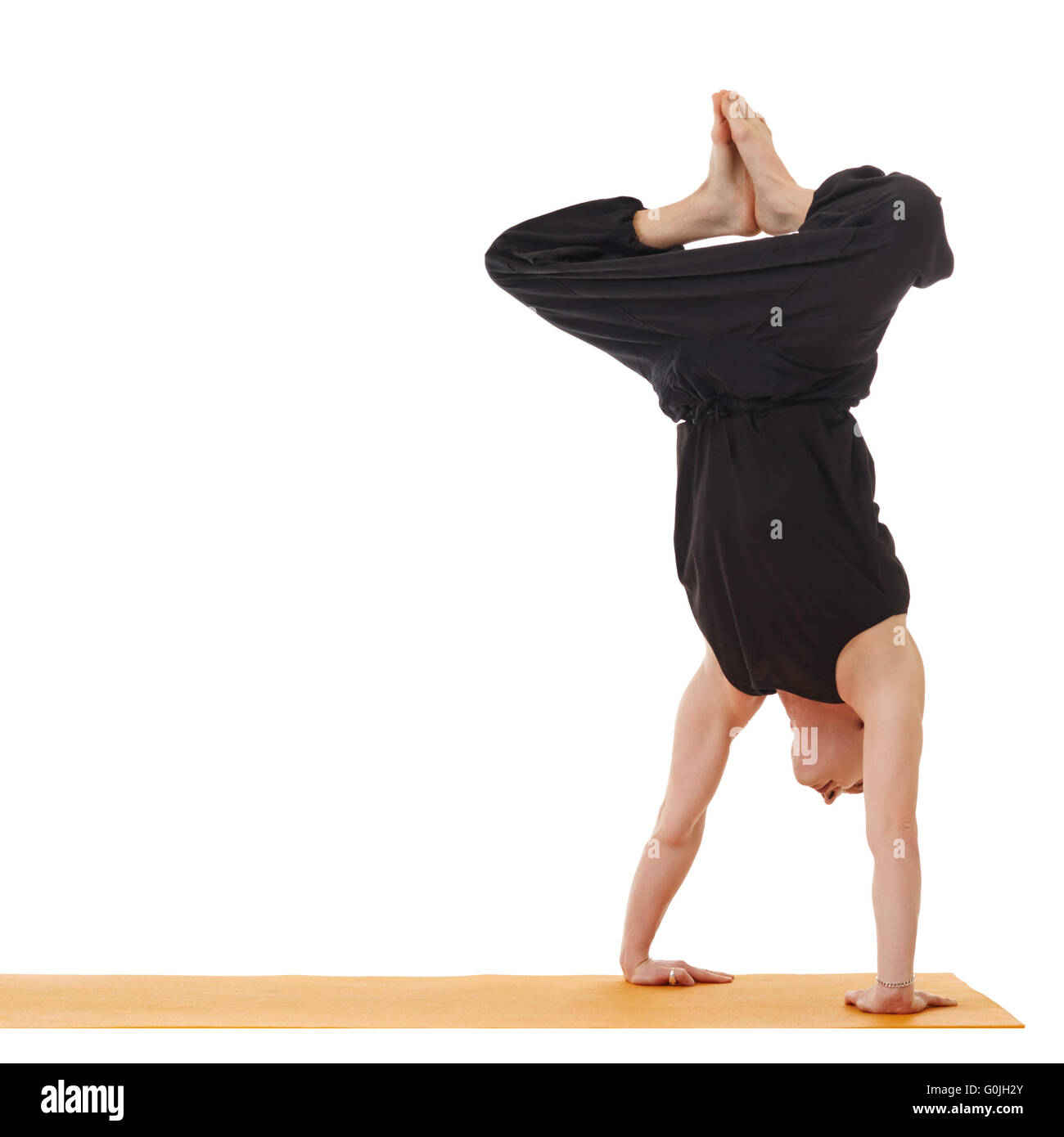 Yoga lessons. Image of instructor doing handstand Stock Photo