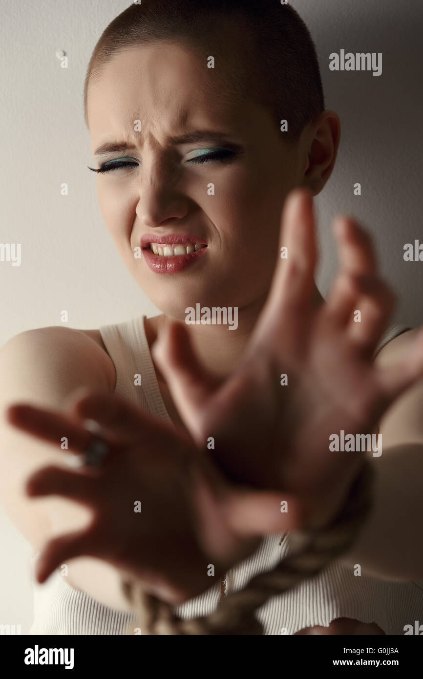 Portrait of frustrated woman with tied hands Stock Photo