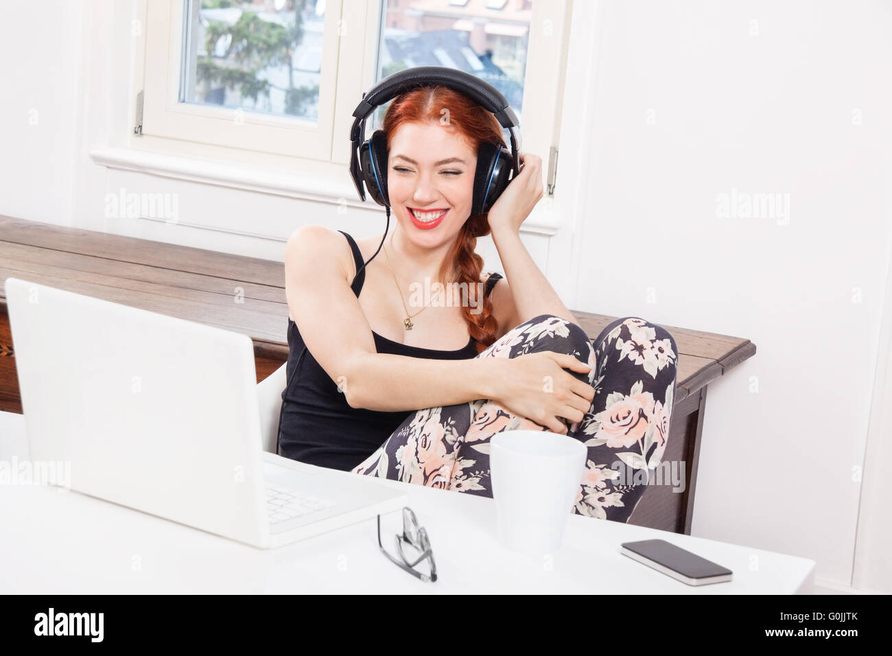 Happy Young Woman Listening Music In her Room Stock Photo - Alamy