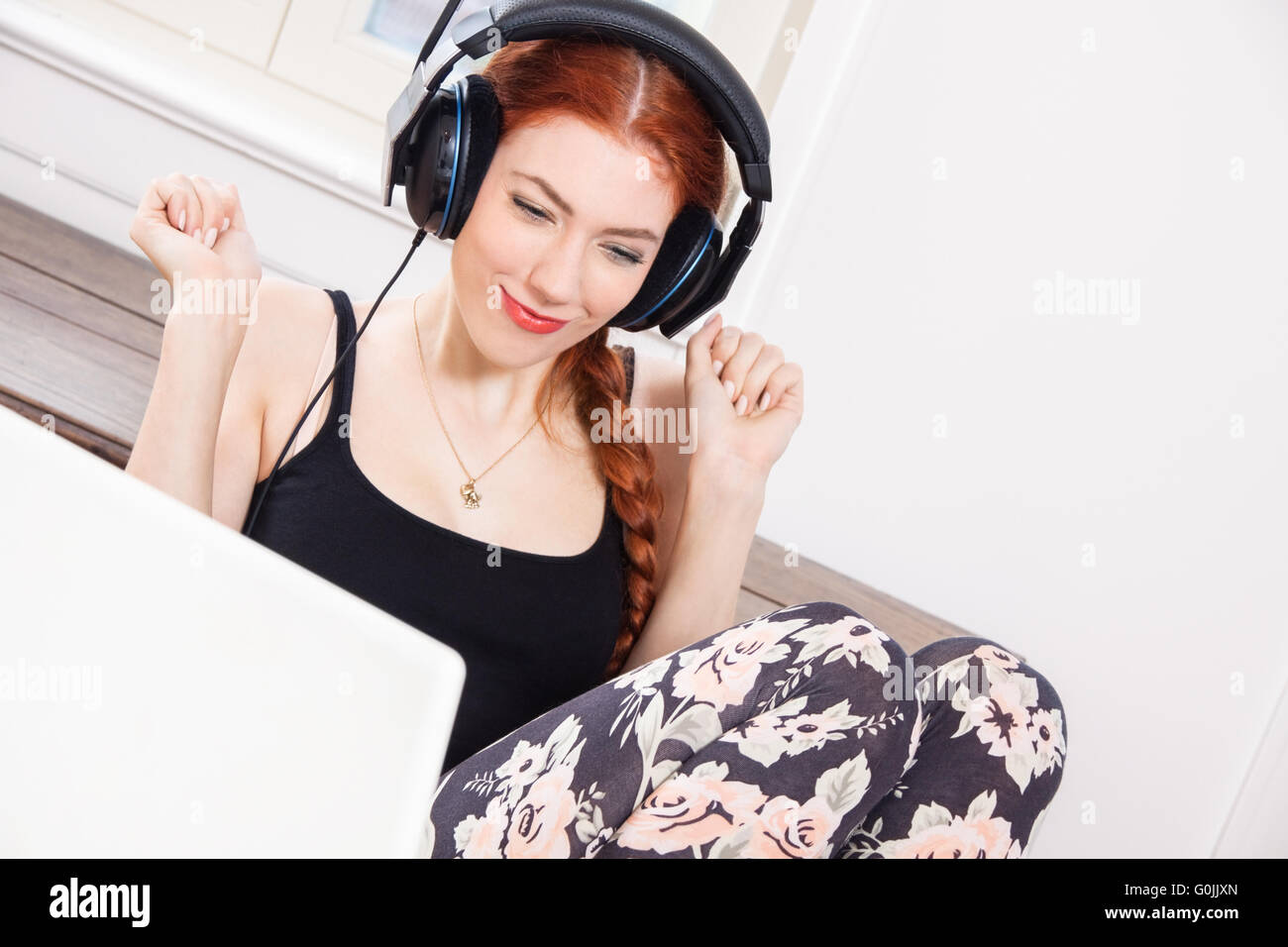 Happy Young Woman Listening Music In her Room Stock Photo - Alamy