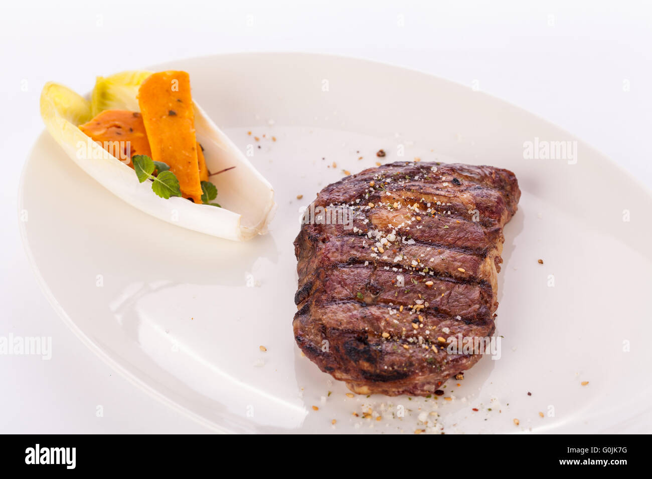 Grilled beef steak with seasoning Stock Photo - Alamy