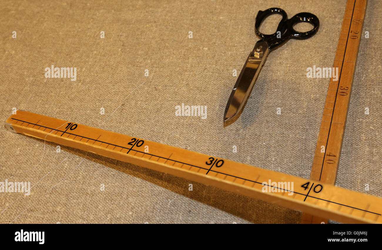 large tailor's scissors with the wooden meter in the Italian artisan