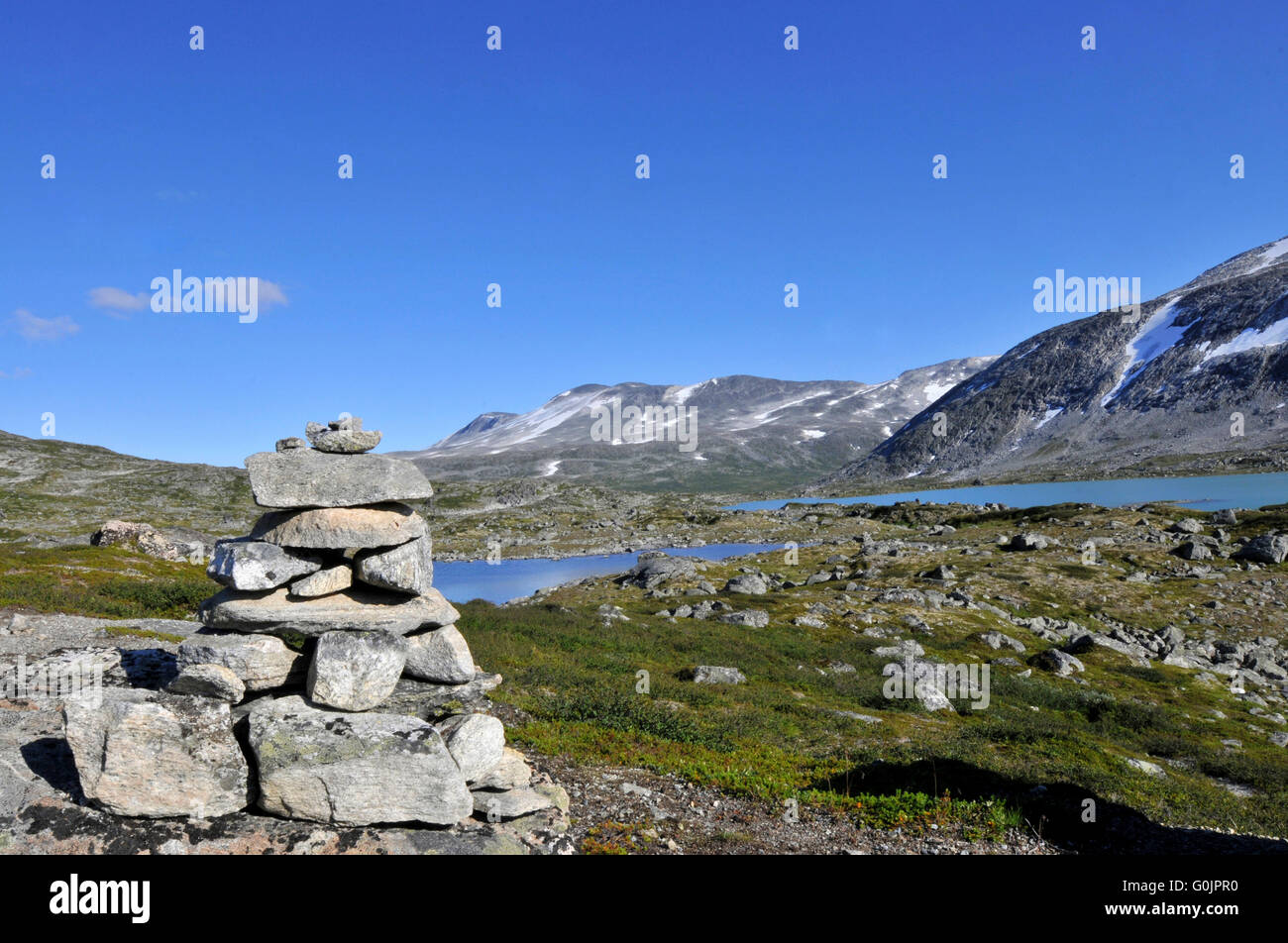 Stone tower, tundra, glacial lake, Gamle Strynfjellsveg, Old Strynfjell Way, Fjell, Hordaland, Norway Stock Photo