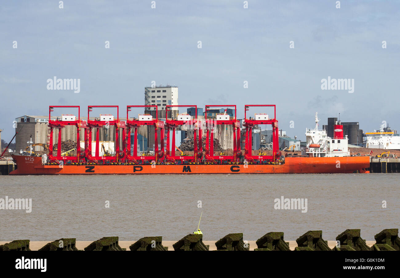 Operational cantilever rail-mounted gantry (CRMG) cranes iLiverpool, Merseyside, UK 2nd May, 2016. Chinese steel cranes ZPMC arrive in the Mersey.  The Zhen Hua ship set off from a dock in Nantong, China, carrying six cranes that will be used on the £300m Liverpool2 deep-water container terminal construction project. The scheme, being led by Peel Ports, aims to deepen the Mersey estuary so it can accommodate some of the biggest boats in the world. A total of eight ship-to-shore ‘megamax’ cranes and 22 cantilever rail-mounted gantry cranes are being supplied to Peel Ports as part of Liverpool2. Stock Photo