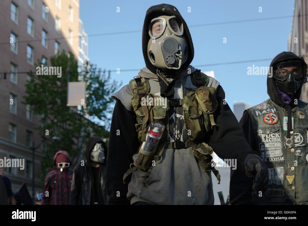 Seattle, WA, USA. 1st May, 2016. Anti-Capitalist/Police/Racism protesters march on the street with protective gear including gas masks. Stock Photo