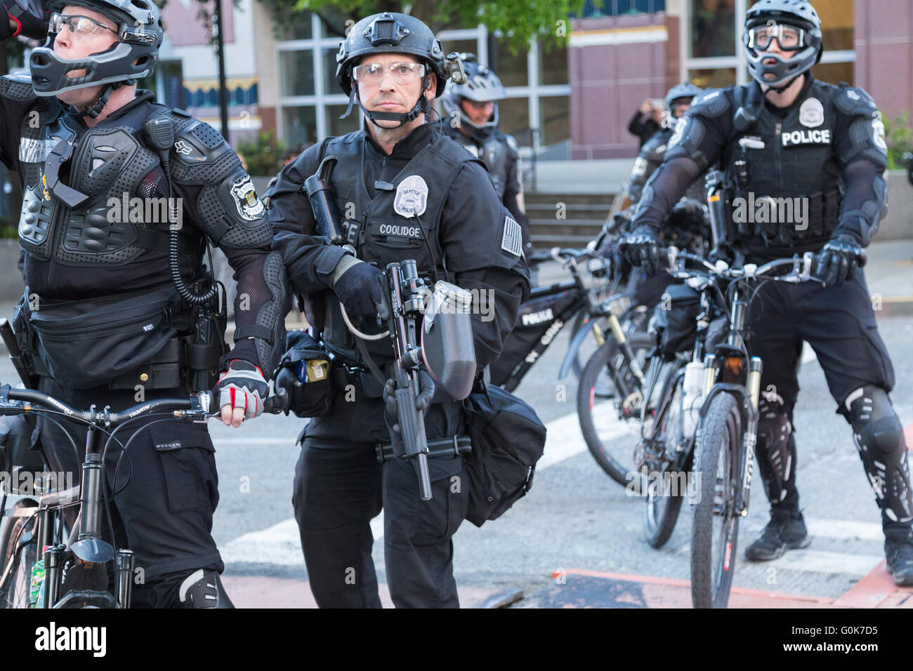 Seattle, WA, USA. 1st May, 2016. Police officers respond with crowd dispersal device against Anti-Capitalist/Police activists. Stock Photo