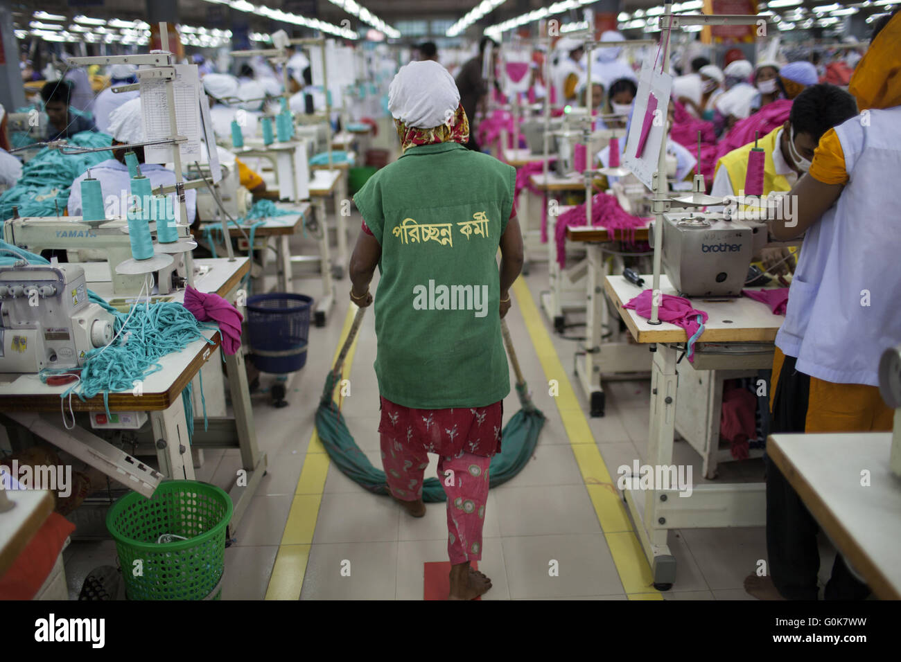 Dhaka, Dhaka, Bangladesh. 31st May, 2014. A woman sweeps the floor in a