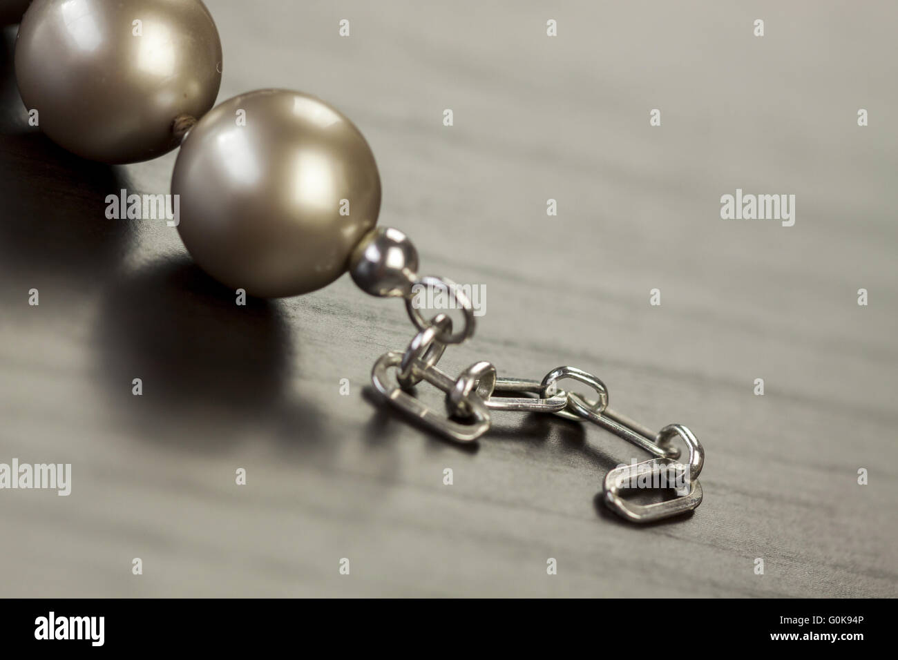 String of shiny grey beads Stock Photo