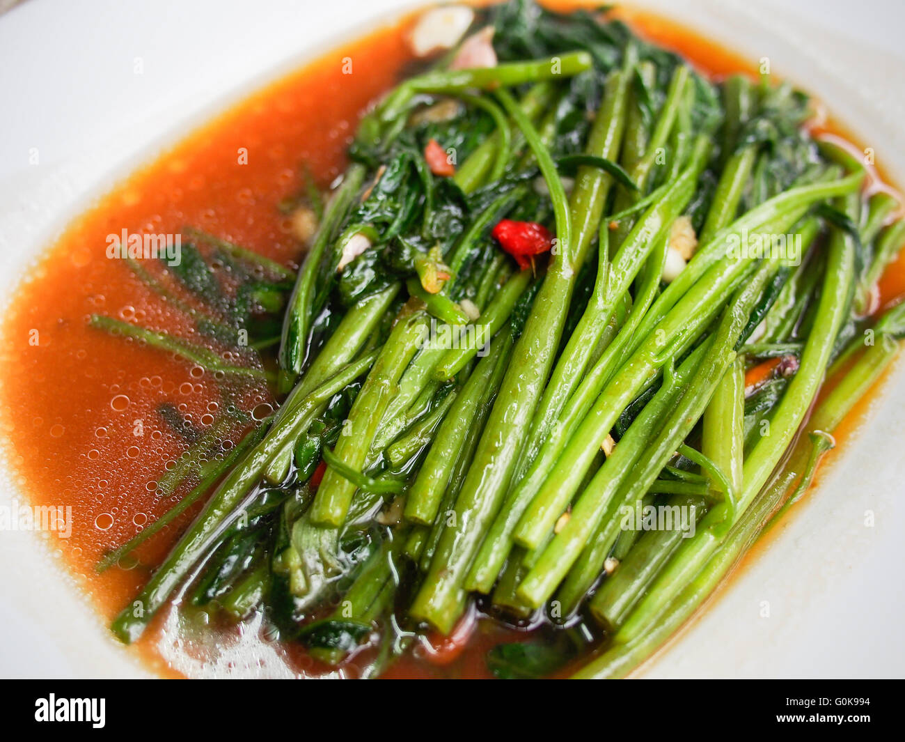 fried water spinach, fried morning glory Stock Photo