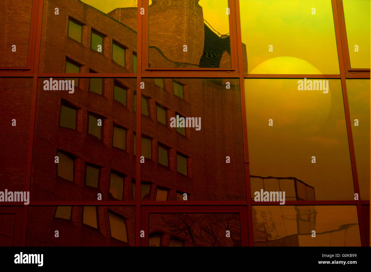 Office building at sunrise with sun reflected in glass Stock Photo - Alamy