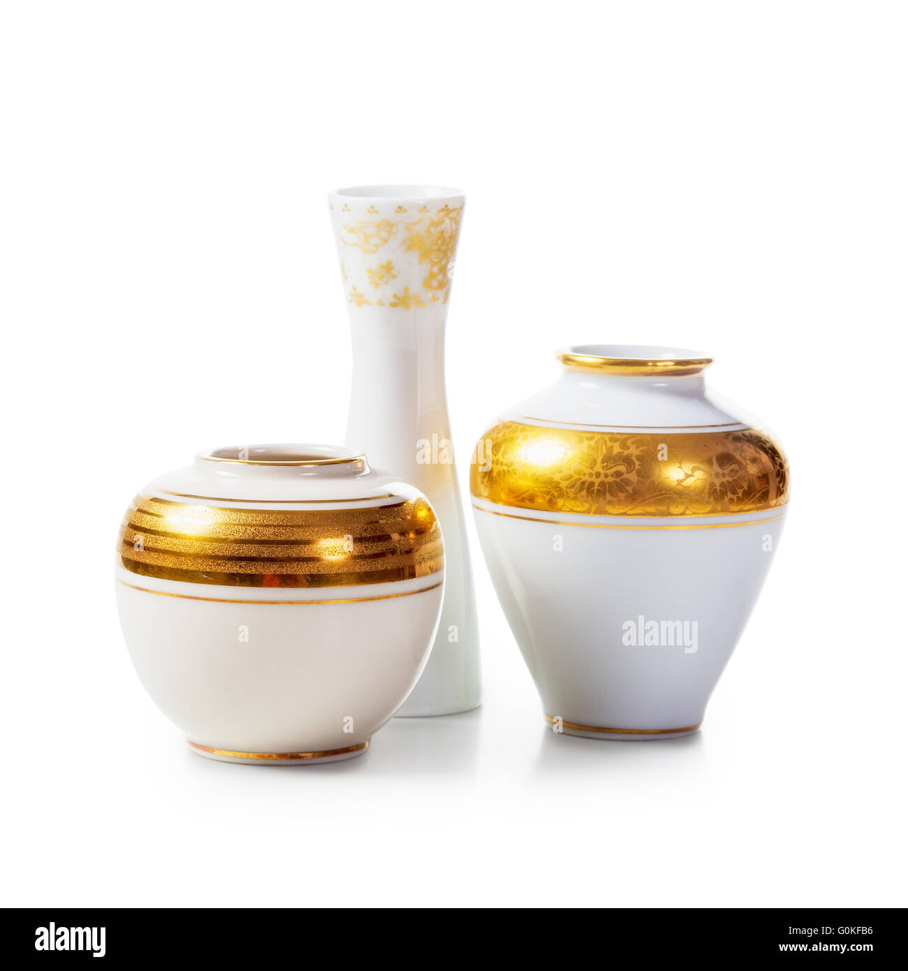 Three antique white porcelain vases on white background. Small objects group clipping path included Stock Photo