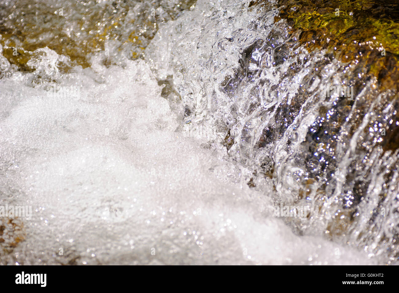 alpin stream with water cascade in detail Stock Photo