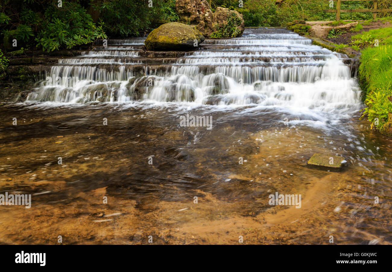 A man-made stepped waterfall within the grounds of Newstead Abbey. At Newstead Abbey, Newstead, Nottinghamshire, England Stock Photo