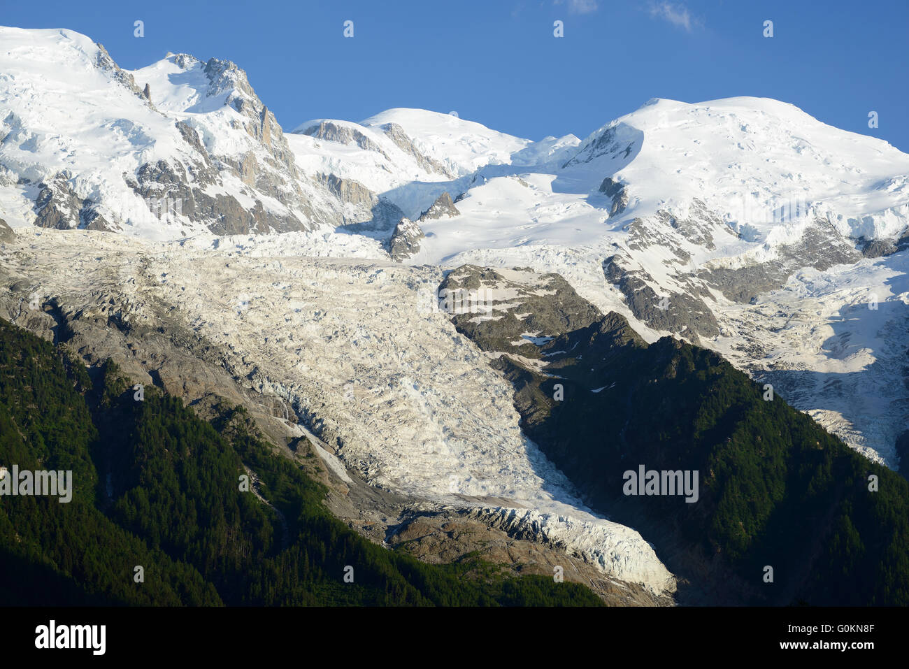 Mont-Blanc (middle 4810m), Bossons Glacier (down to 1600m), Dôme du Goûter (right). Chamonix Mont-Blanc, Haute-Savoie, Auvergne-Rhône-Alpes, France. Stock Photo