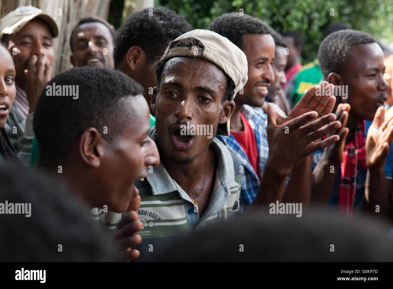 Suten village market, Oromia, Ethiopia, October 2013 Teenagers chanting and singing. Stock Photo