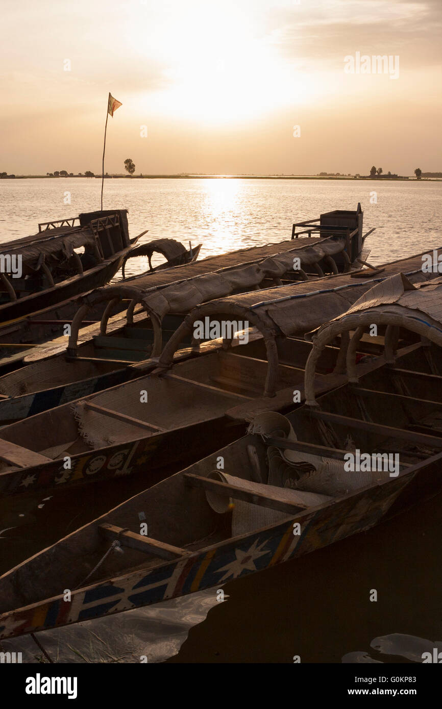 Pirogues at sunset on River Niger in Mopti Stock Photo