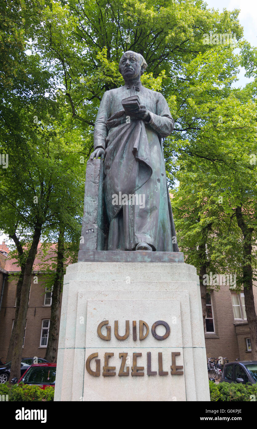 Statue of Guido Gezelle in Guido Gezelleplein, Bruges, Belgium Stock Photo