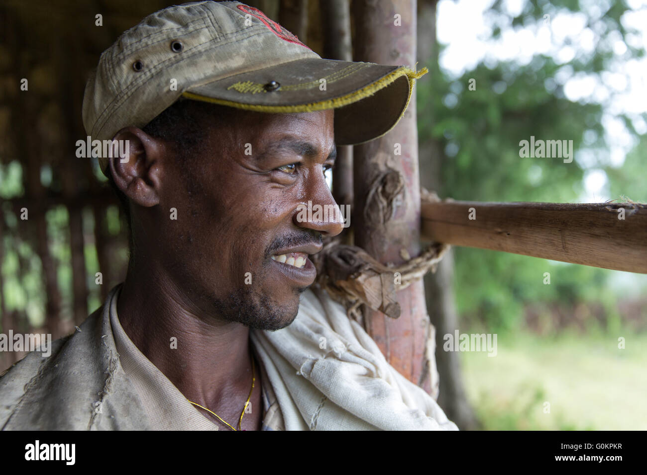 Debre Mahela Kebele, North Shewa,  Ethiopia, October 2013: People take shelter from a passing rain shower. Stock Photo