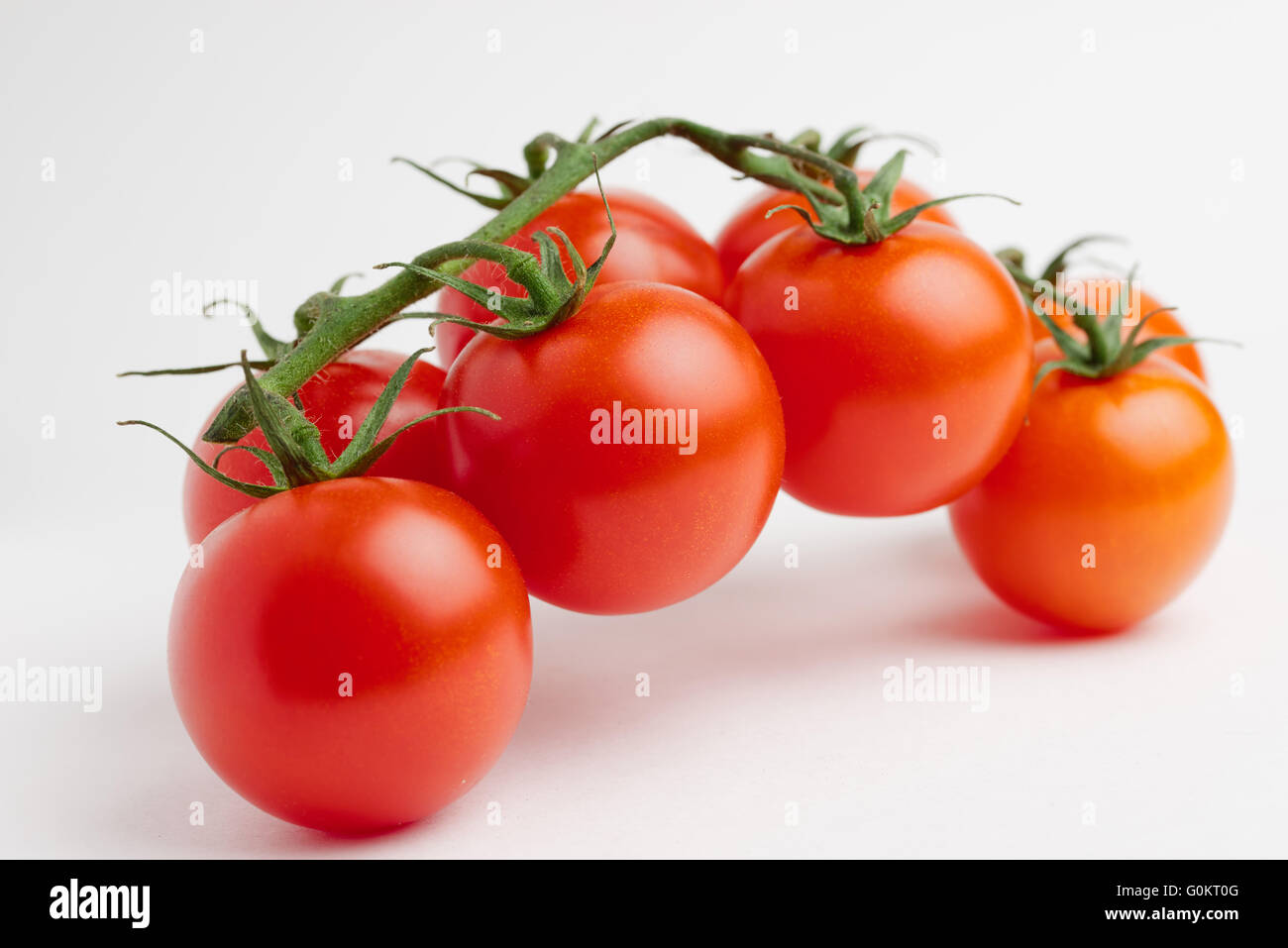 cherry tomatoes on white background Stock Photo - Alamy